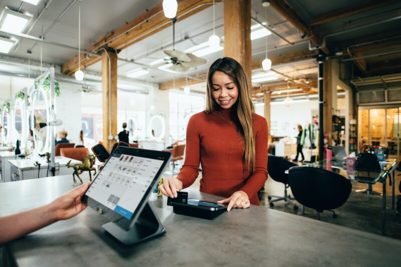 Woman paying at the counter
