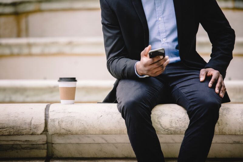 Man reading blogs on his phone